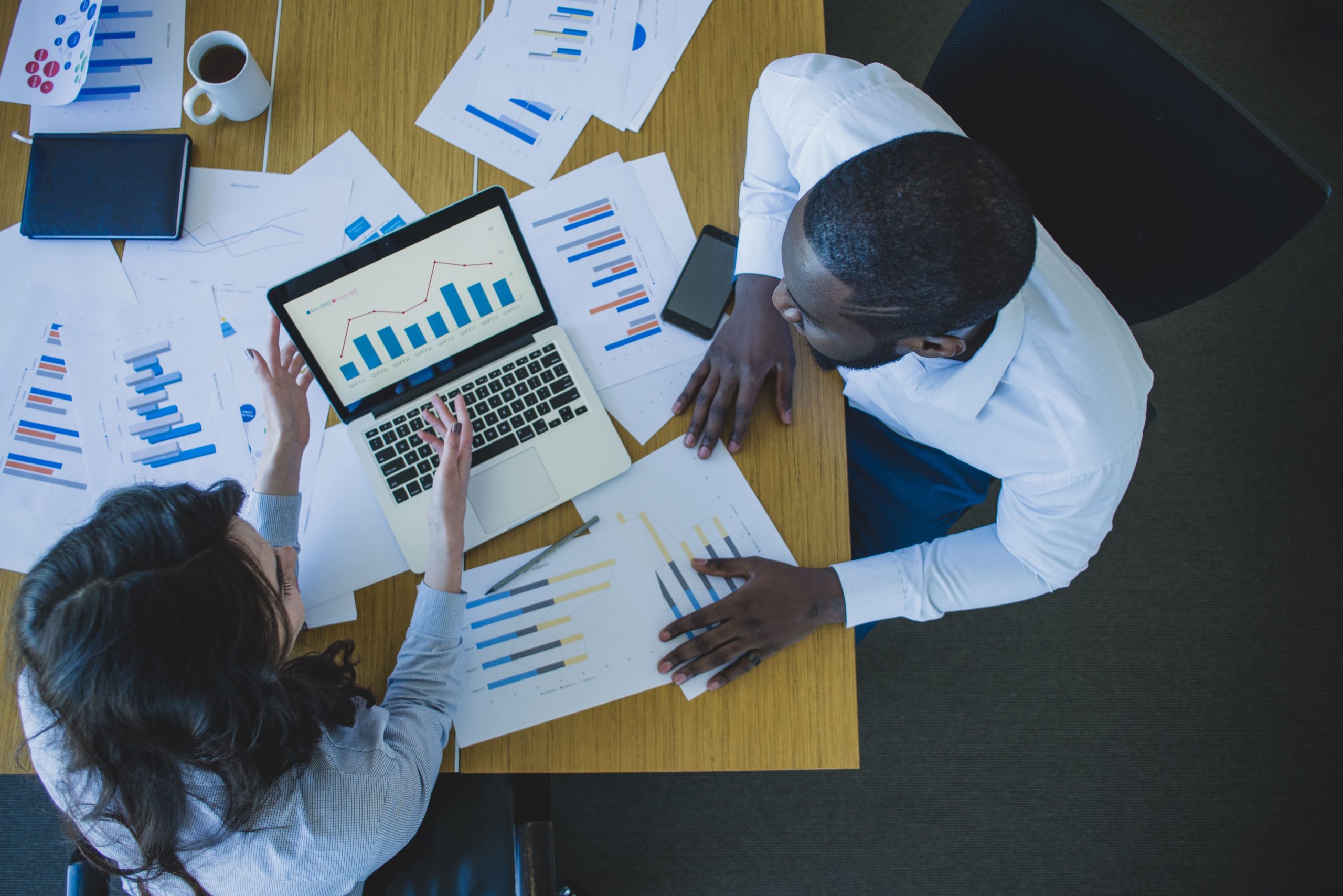 two people in office doing data acquisition and annotation services for fintech